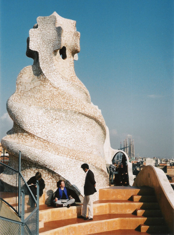 Gaudi: Case Mila roof, with Sagrada Familia, Barcelona