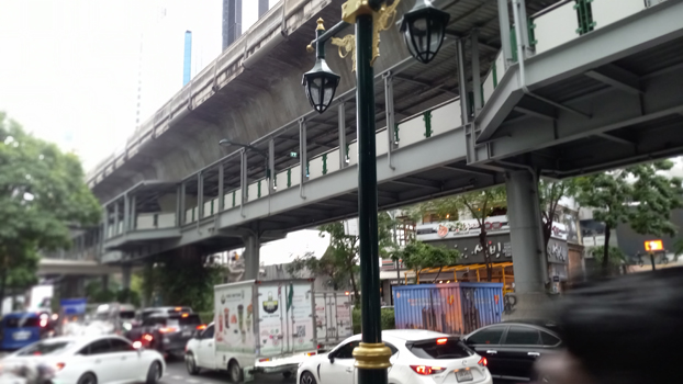 Skywalk beneath Skytrain tracks along Sukhumvit Road, Bangkok, Thailand