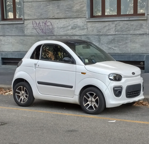 Tiny electric city car in Milan, Italy. Photo by David Wineberg