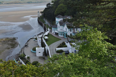 Low tide, main building and stone boat, Portmeirion Hotel, Wales, UK